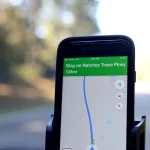 smartphone on car mount with navigation map