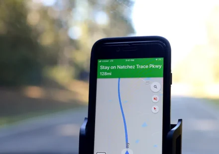 smartphone on car mount with navigation map