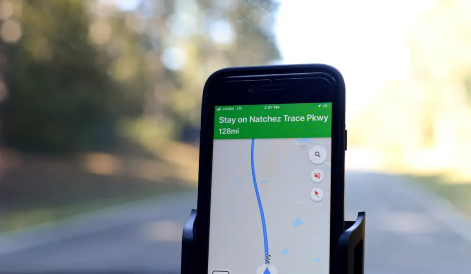 smartphone on car mount with navigation map