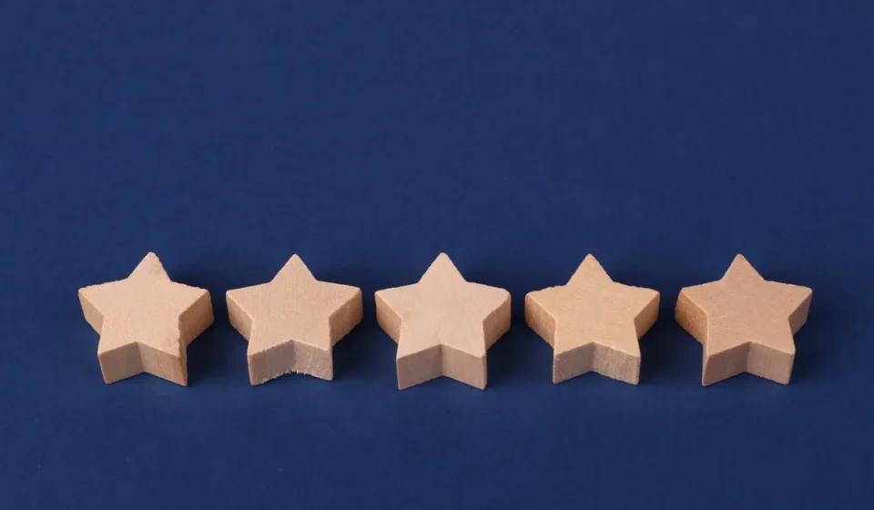 Five star rating icons on a blue background